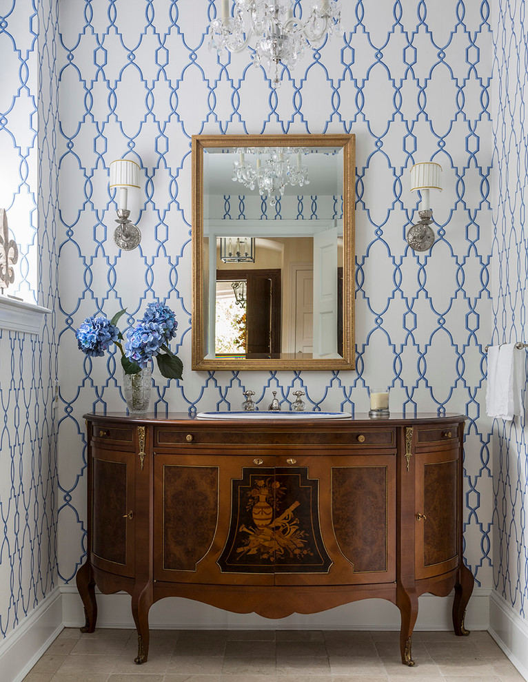 Design ideas for a traditional powder room in Philadelphia with a drop-in sink, furniture-like cabinets, medium wood cabinets, wood benchtops and brown benchtops.