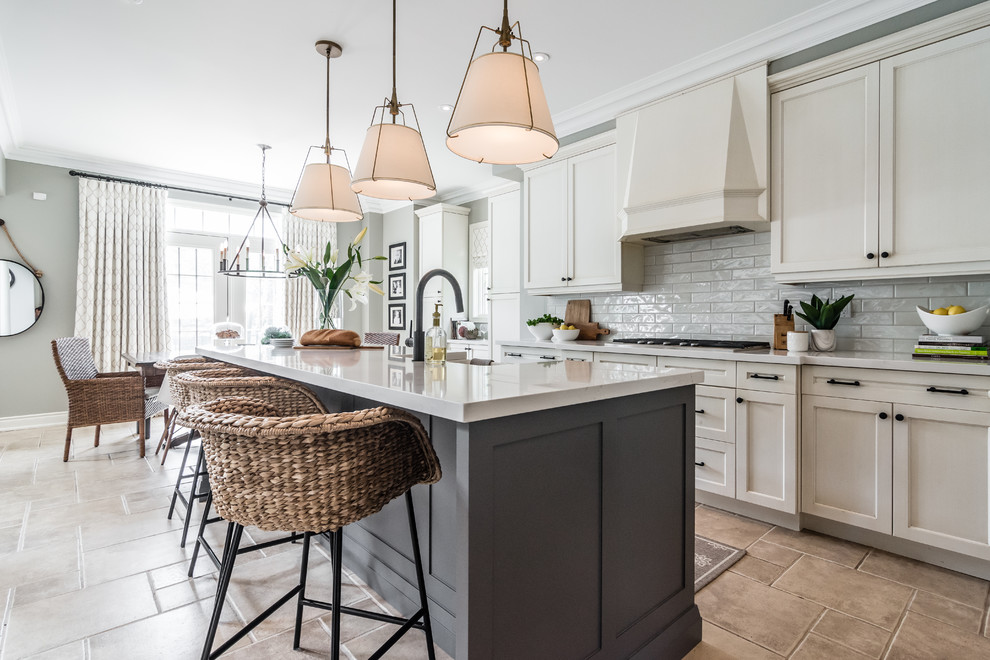 Design ideas for a transitional galley eat-in kitchen in Toronto with a farmhouse sink, recessed-panel cabinets, beige cabinets, white splashback, with island, beige floor and white benchtop.