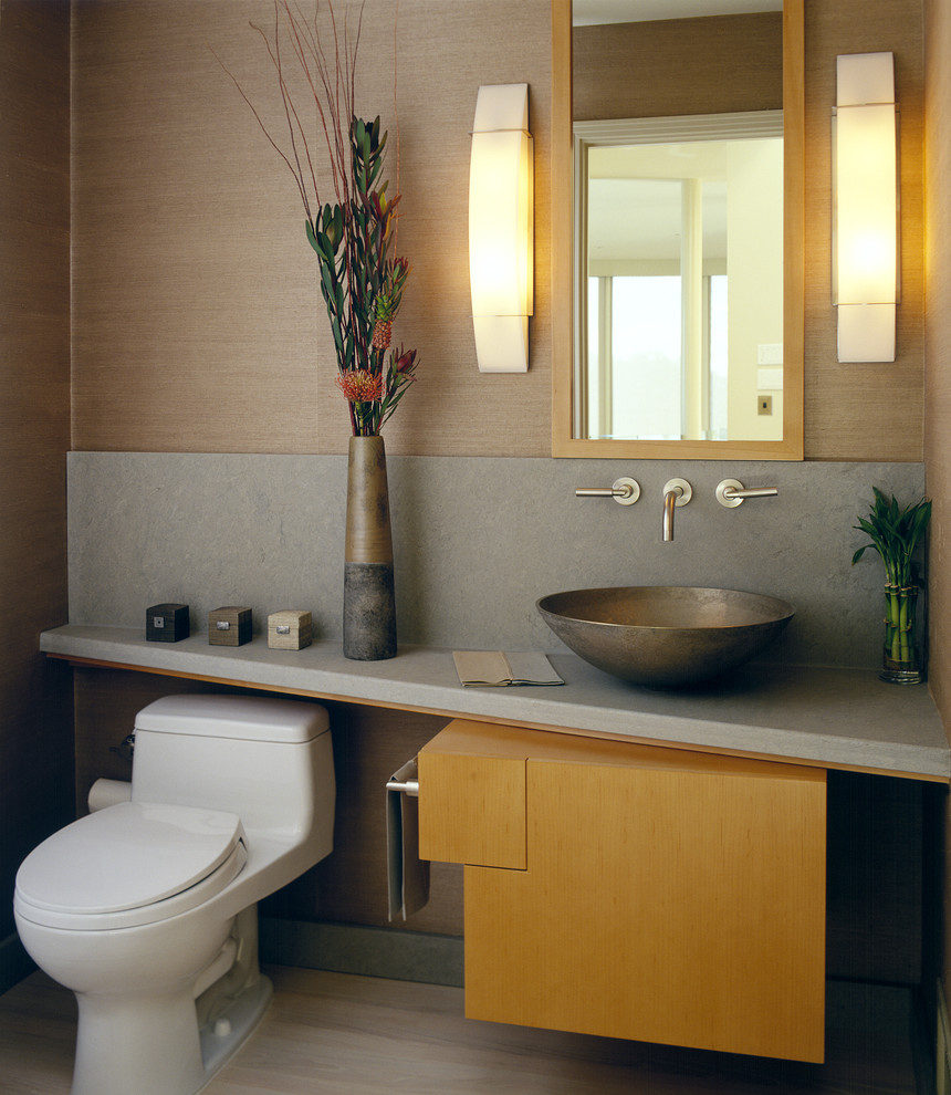 Photo of a contemporary powder room in San Francisco with a vessel sink and grey benchtops.
