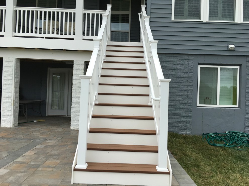 Inspiration for a large backyard concrete paver deck remodel in Baltimore