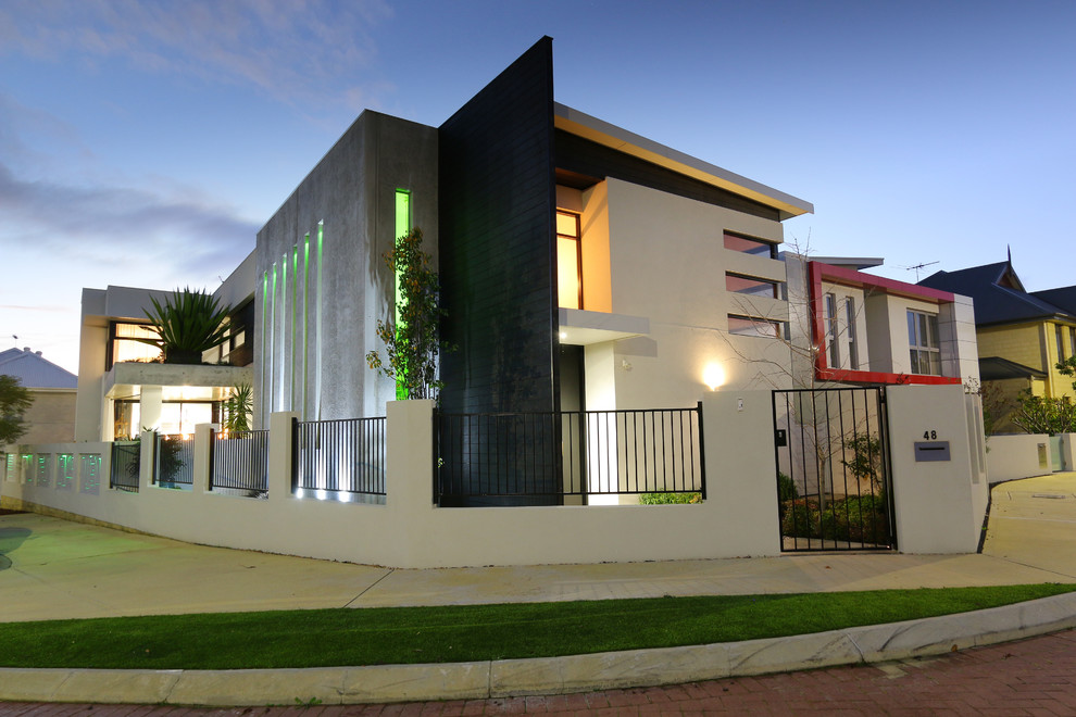 This is an example of a large contemporary two-storey brick beige exterior in Perth.