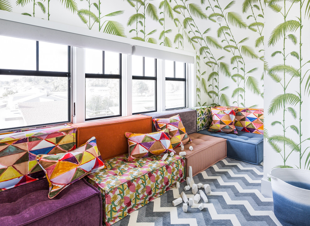 Design ideas for a beach style gender-neutral kids' playroom for kids 4-10 years old in Seattle with multi-coloured walls, carpet and multi-coloured floor.