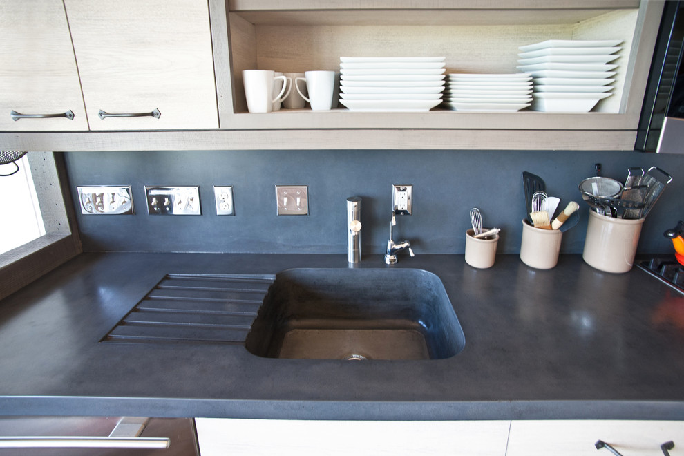 Inspiration for a rustic home design remodel with an integrated sink, concrete countertops, gray backsplash and cement tile backsplash