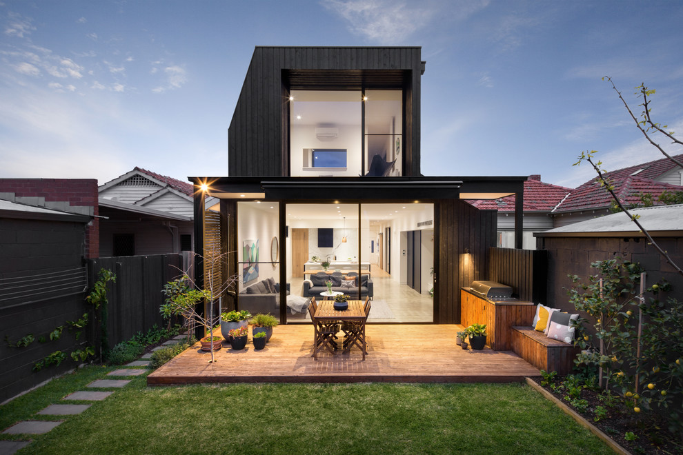 Design ideas for a contemporary two-storey black exterior in Melbourne.