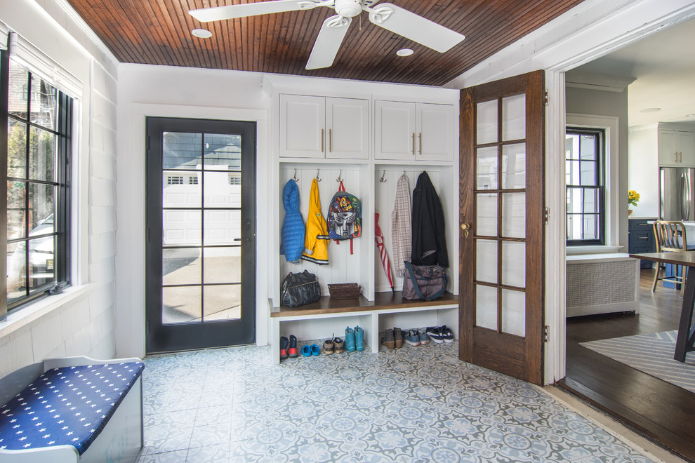 Photo of a large transitional mudroom in Newark with white walls, vinyl floors, a single front door, a black front door and blue floor.