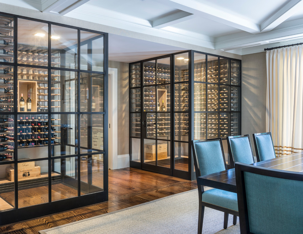 Inspiration for a contemporary wine cellar in New York with dark hardwood floors, storage racks and brown floor.