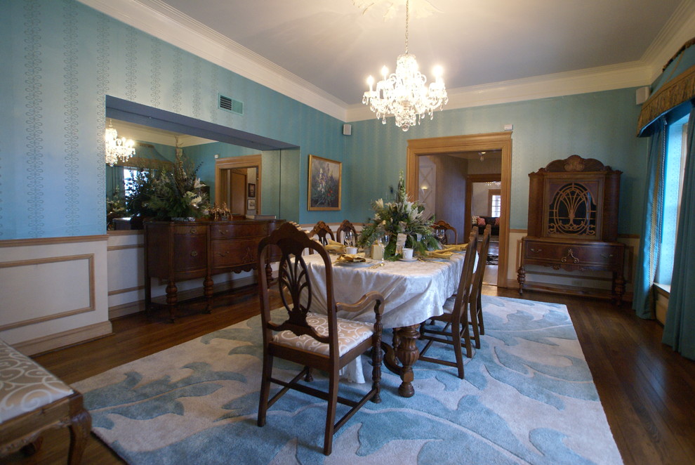 Design ideas for a large eclectic separate dining room in St Louis with metallic walls and dark hardwood floors.