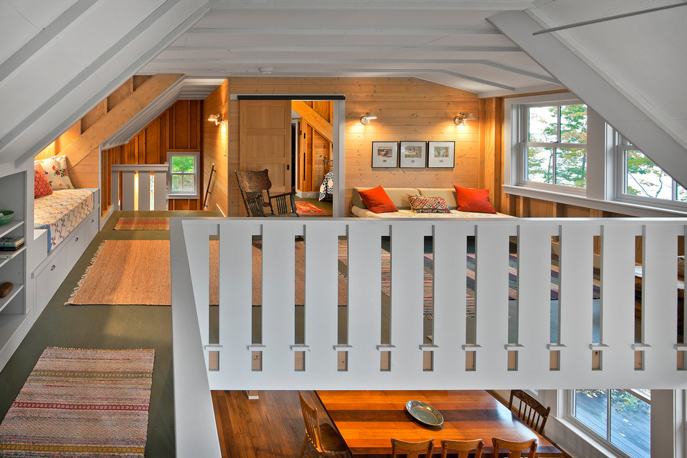 Photo of a mid-sized country loft-style family room in Minneapolis with white walls, no fireplace and no tv.