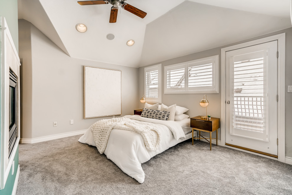 Design ideas for a large modern master bedroom in Denver with carpet, a two-sided fireplace and a vaulted ceiling.