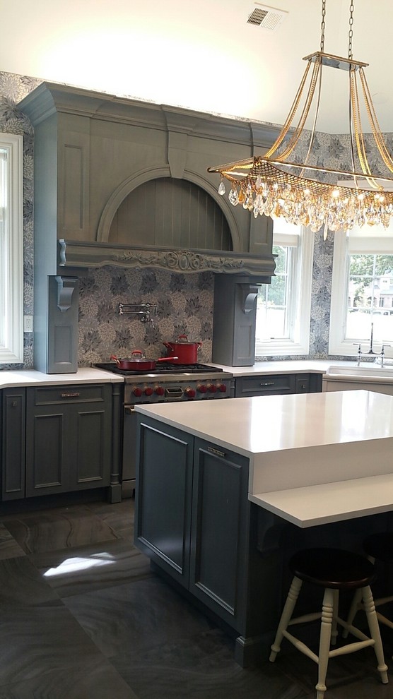 Inspiration for a large transitional u-shaped kitchen remodel in New York with a farmhouse sink, recessed-panel cabinets, gray cabinets and an island