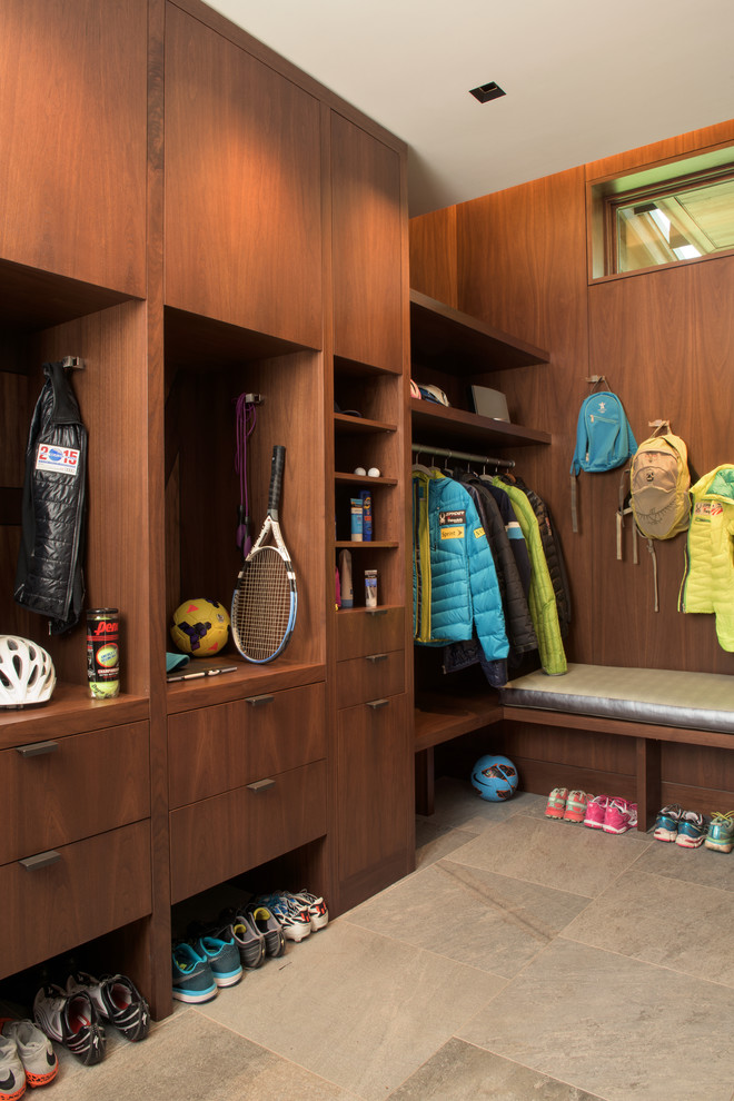 Inspiration for an expansive contemporary mudroom in Denver with brown walls.