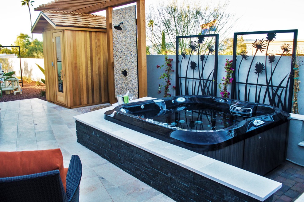 Inspiration for a large modern backyard patio in Phoenix with an outdoor shower, stamped concrete and a pergola.