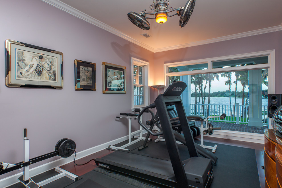 Design ideas for a large traditional multipurpose gym in Orlando with purple walls and dark hardwood floors.