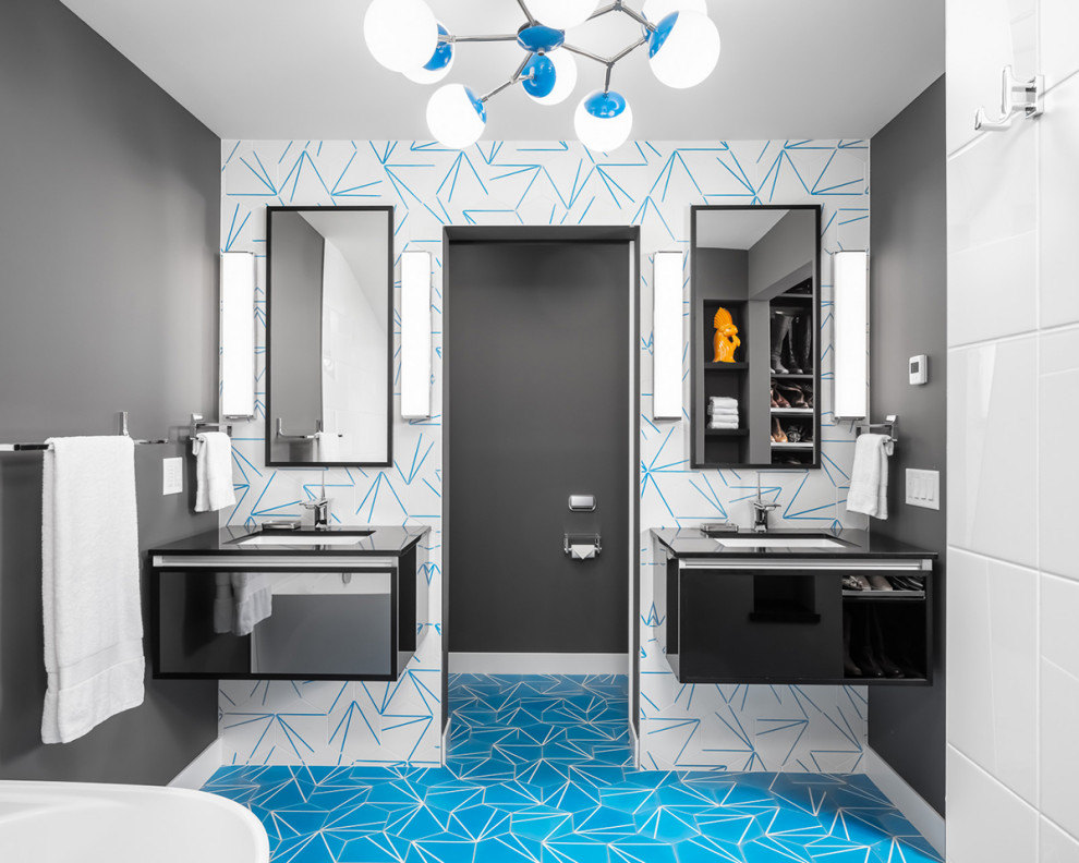 Inspiration for a large midcentury master bathroom in Minneapolis with glass-front cabinets, black cabinets, a freestanding tub, a one-piece toilet, multi-coloured tile, grey walls, a wall-mount sink, blue floor, black benchtops, an enclosed toilet, a double vanity and a floating vanity.