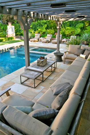 Inspiration for a large traditional backyard full sun outdoor sport court for summer in San Francisco with natural stone pavers and with pond.