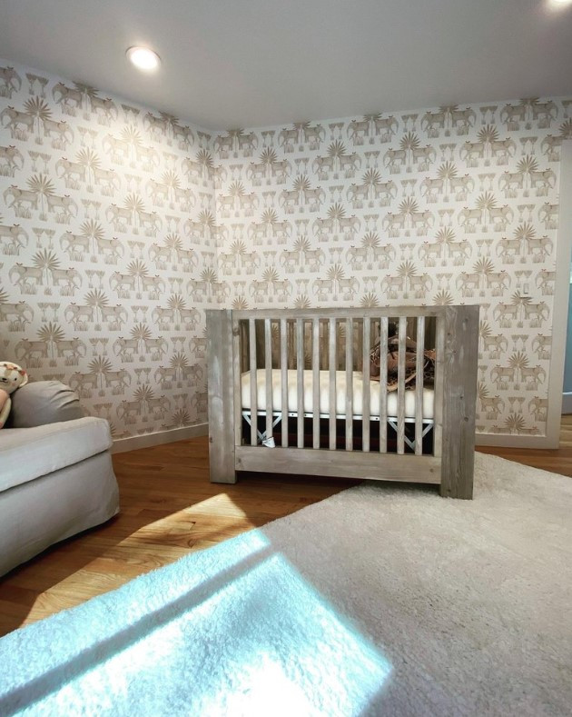Nursery - huge 1950s gender-neutral ceramic tile, black floor, vaulted ceiling and shiplap wall nursery idea in New York with brown walls