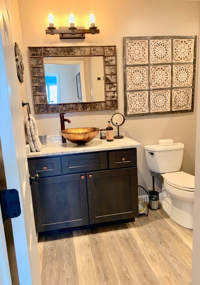 Bathroom with shaker cabinets, grey cabinets, an open shower, beige tile, porcelain tile, beige walls, vinyl floors, a vessel sink, granite benchtops, brown floor, an open shower and multi-coloured benchtops.