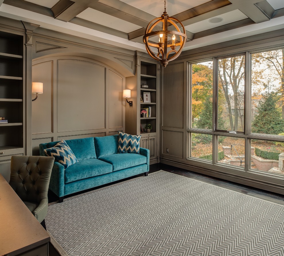 Inspiration for a large transitional study room in Detroit with a built-in desk, grey walls and dark hardwood floors.