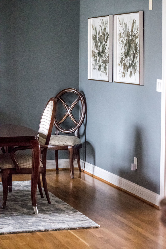 Mid-sized transitional separate dining room in Louisville with grey walls, medium hardwood floors and orange floor.
