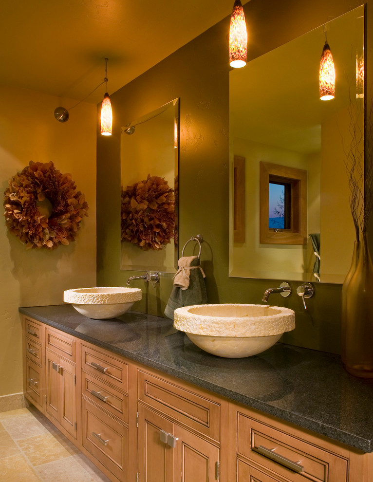 Mid-sized country master bathroom in Other with recessed-panel cabinets, light wood cabinets, green walls, travertine floors, a vessel sink, granite benchtops and beige floor.