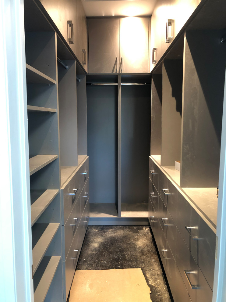 Photo of a small modern storage and wardrobe in Other with flat-panel cabinets and grey cabinets.