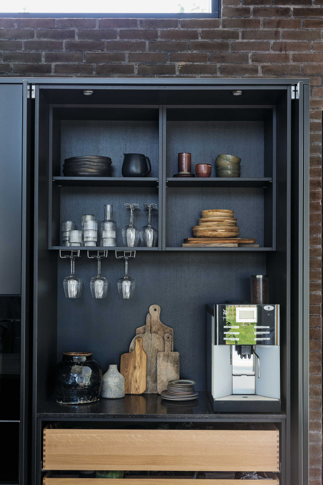 Inspiration for a large scandinavian galley home bar in Aalborg with flat-panel cabinets, grey cabinets, wood benchtops, concrete floors and grey floor.