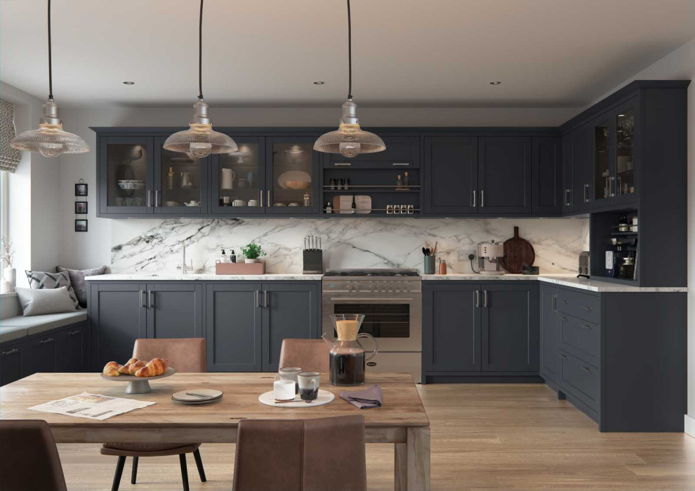 Design ideas for a mid-sized contemporary l-shaped eat-in kitchen in Other with a drop-in sink, shaker cabinets, blue cabinets, quartzite benchtops, white splashback, engineered quartz splashback, stainless steel appliances, laminate floors, no island, brown floor and white benchtop.