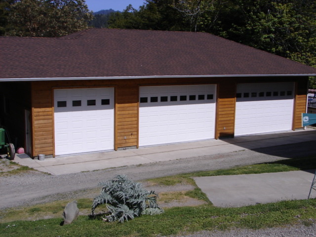 Large traditional detached three-car carport in Other.