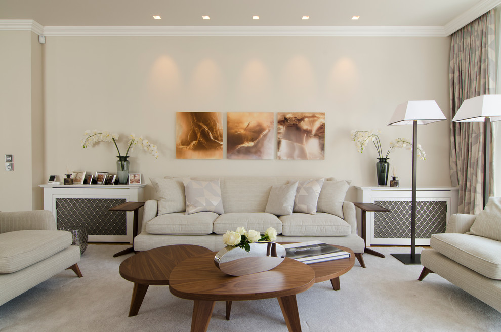 Photo of a transitional formal living room in London with beige walls.