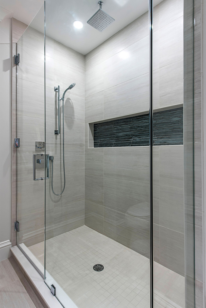 Design ideas for a contemporary bathroom in Other with an alcove shower, beige tile, porcelain tile and a hinged shower door.