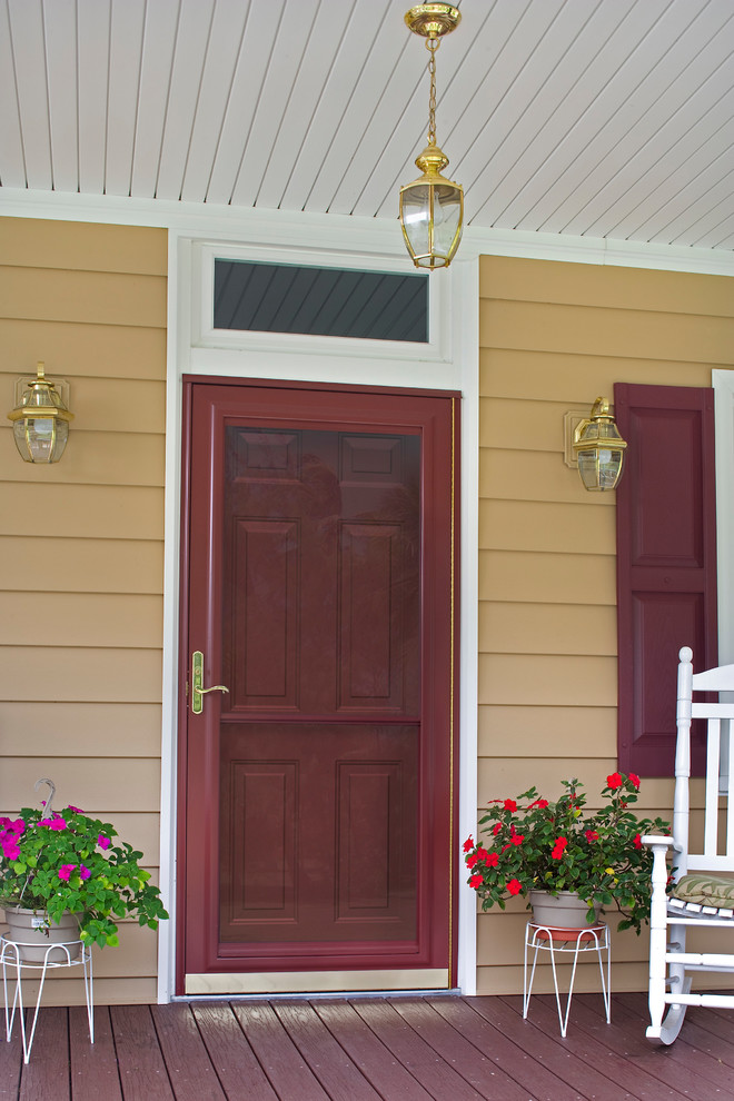 Mid-sized contemporary front door in Cleveland with a single front door and a red front door.