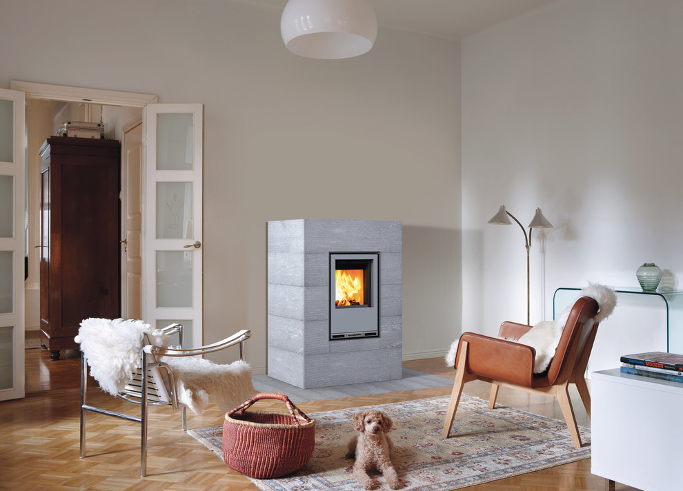 Inspiration for an expansive scandinavian living room in Gloucestershire with a wood stove.