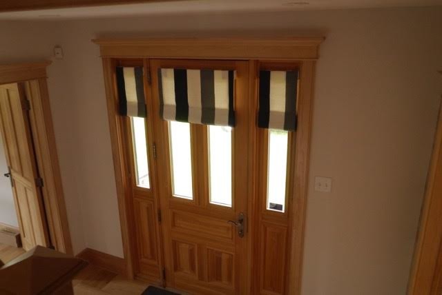 Photo of a large country entryway in Other with light hardwood floors and a single front door.