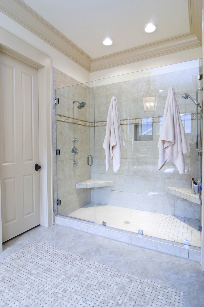 This is an example of a traditional bathroom in San Francisco with an alcove shower and beige tile.