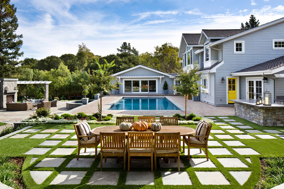 Traditional backyard patio in San Francisco with natural stone pavers and no cover.