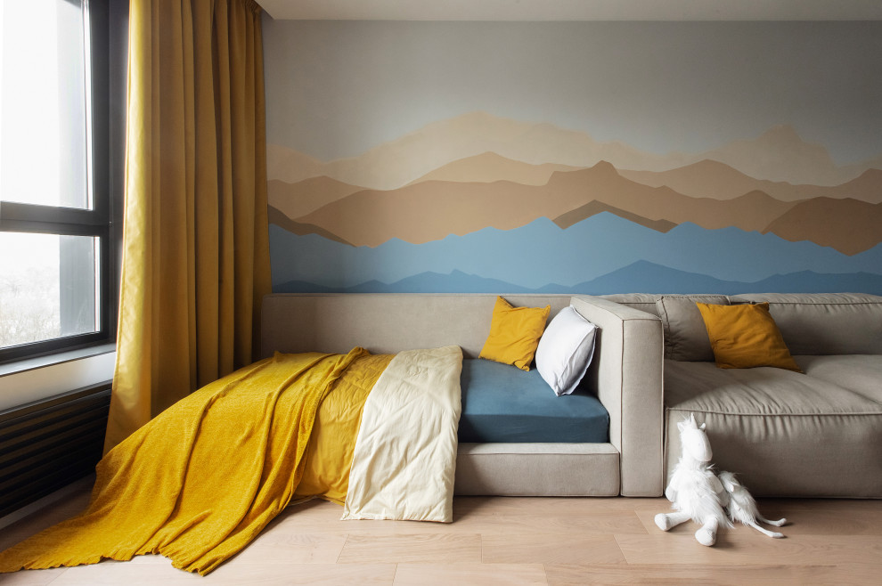 Esempio di una grande cameretta per bambini da 4 a 10 anni minimal con pareti blu e pavimento in legno massello medio