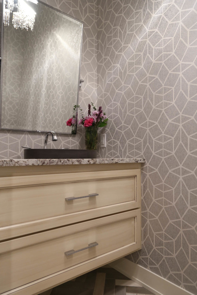 Bathroom - mid-sized transitional 3/4 porcelain tile and gray floor bathroom idea with recessed-panel cabinets, light wood cabinets, a two-piece toilet, gray walls, a drop-in sink, granite countertops and multicolored countertops