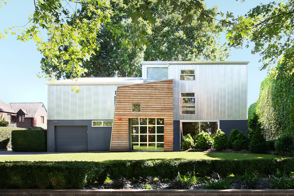 Inspiration for a large contemporary two-storey multi-coloured house exterior in Seattle with metal siding and a shed roof.