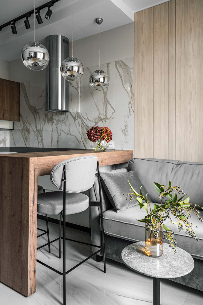 Стильный дизайн: п-образная кухня среднего размера в современном стиле с обеденным столом, полом из керамогранита и полуостровом - последний тренд