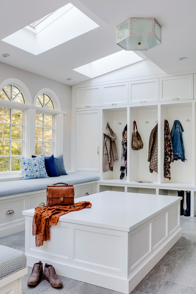 Photo of a large transitional mudroom in Boston with grey walls, ceramic floors, a single front door and a blue front door.