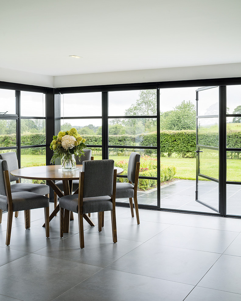 This is an example of a mid-sized transitional dining room in Manchester.