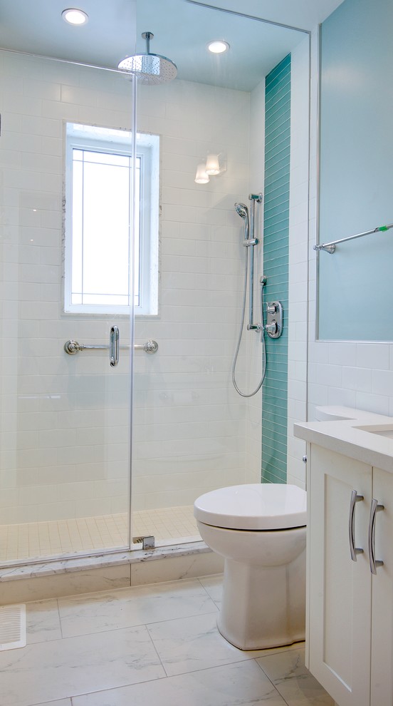 Small traditional kids bathroom in Toronto with an undermount sink, shaker cabinets, white cabinets, granite benchtops, an alcove shower, a one-piece toilet, white tile, ceramic tile, blue walls and porcelain floors.