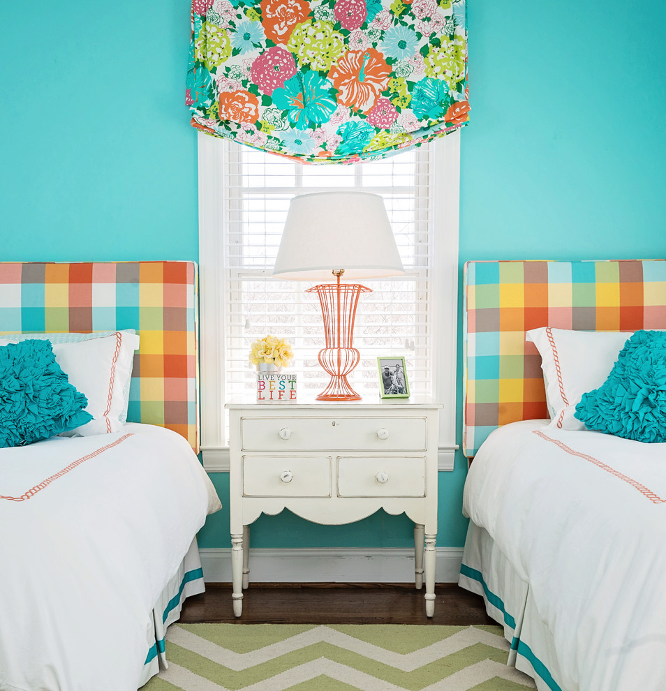 This is an example of a traditional kids' room for girls in Baltimore with blue walls and dark hardwood floors.