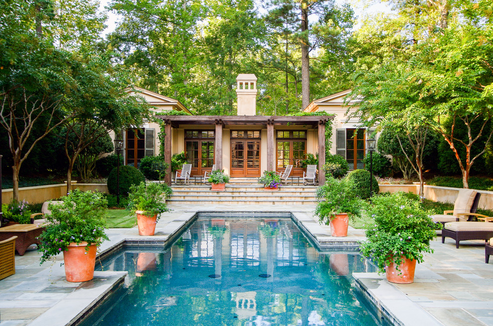 This is an example of a traditional backyard custom-shaped pool in Atlanta.