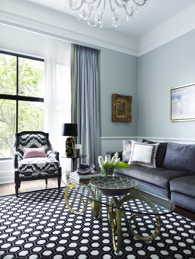 Inspiration for a transitional living room in Sydney with blue walls.