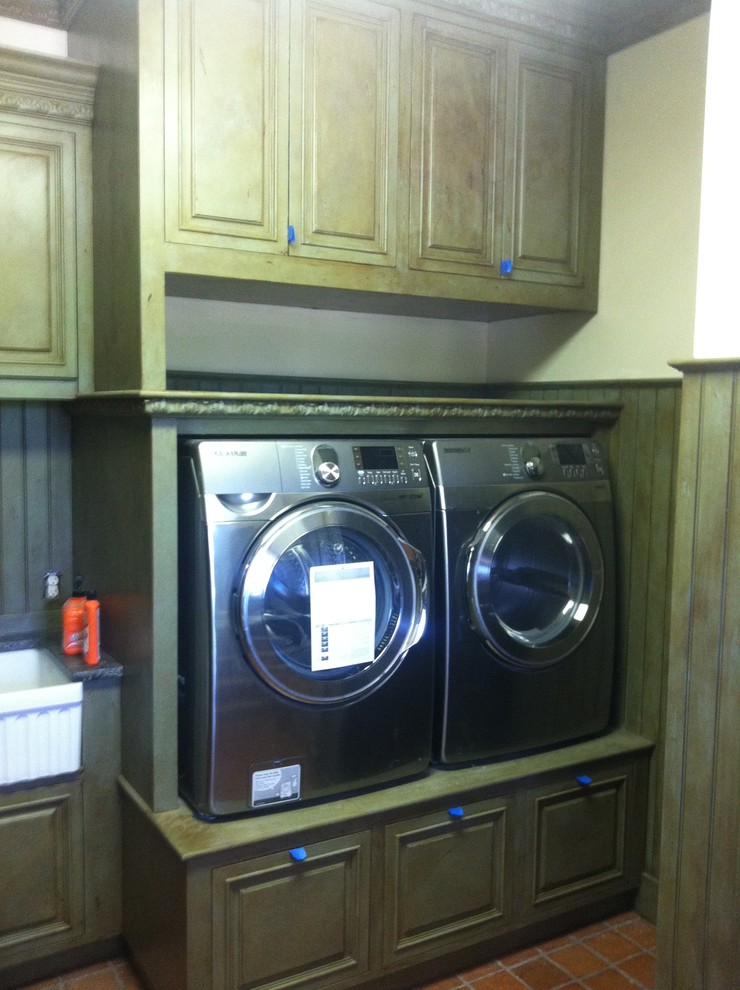 This is an example of a mediterranean laundry room in Burlington.