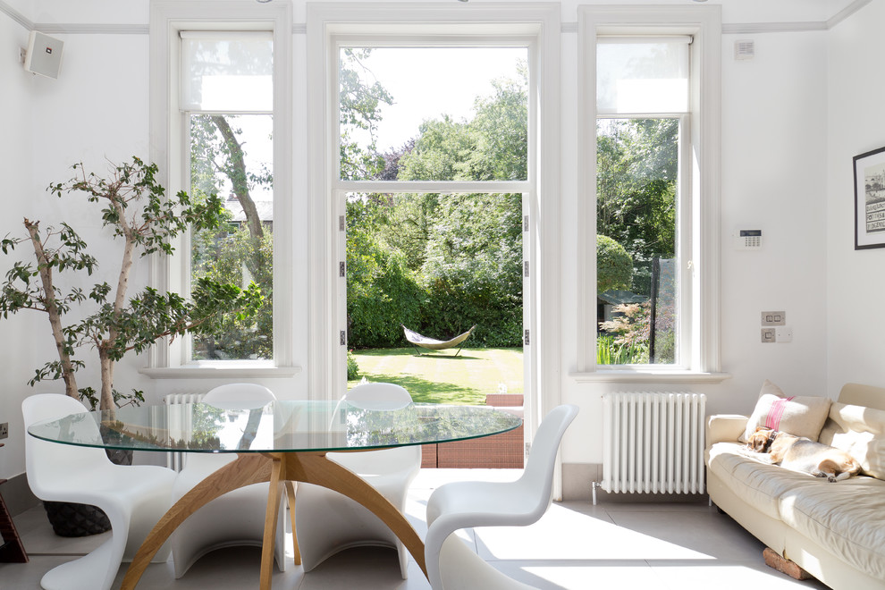 Design ideas for a transitional dining room in Manchester with white walls.