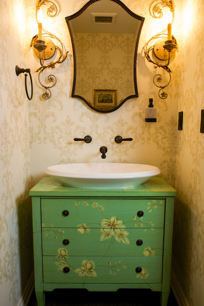 Photo of a small transitional powder room in Los Angeles with furniture-like cabinets, green cabinets, a two-piece toilet, beige walls, dark hardwood floors, wood benchtops and green benchtops.