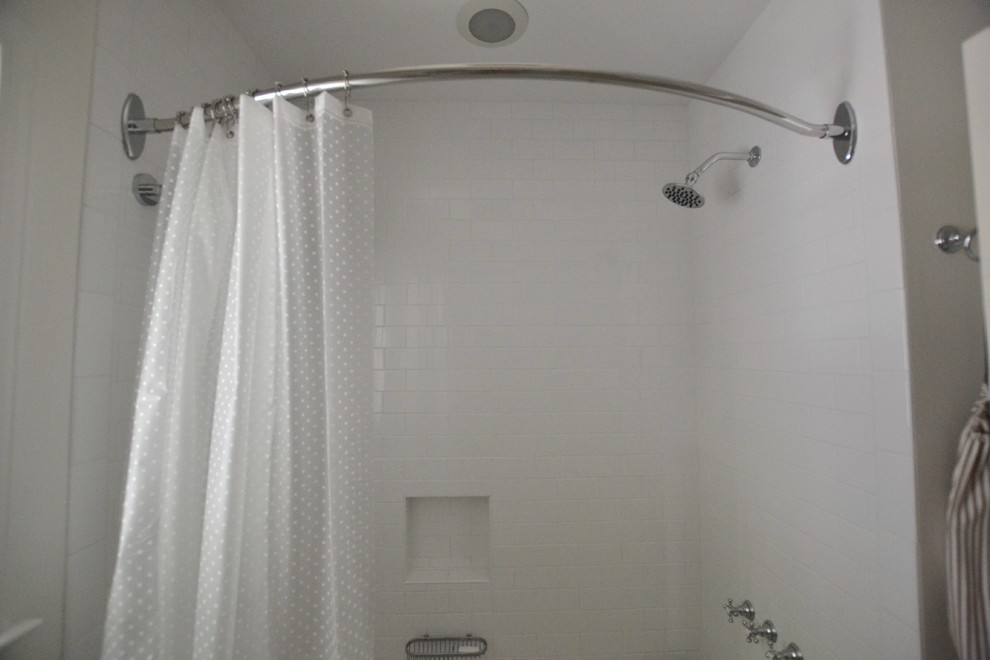Inspiration for a white tile and porcelain tile bathroom remodel in Other with white walls