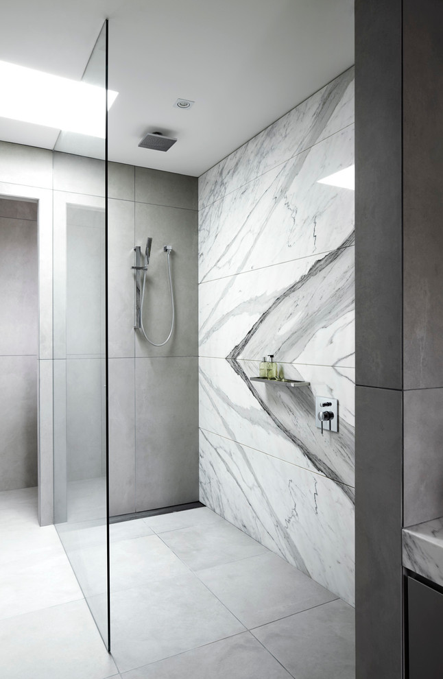 Large contemporary master bathroom in Melbourne with marble benchtops, white tile, grey walls, ceramic floors, a curbless shower and marble.